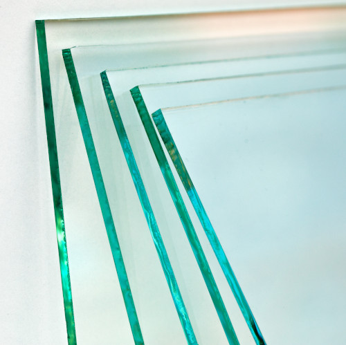 Who first invented the flat glass manufacturing process, and when?