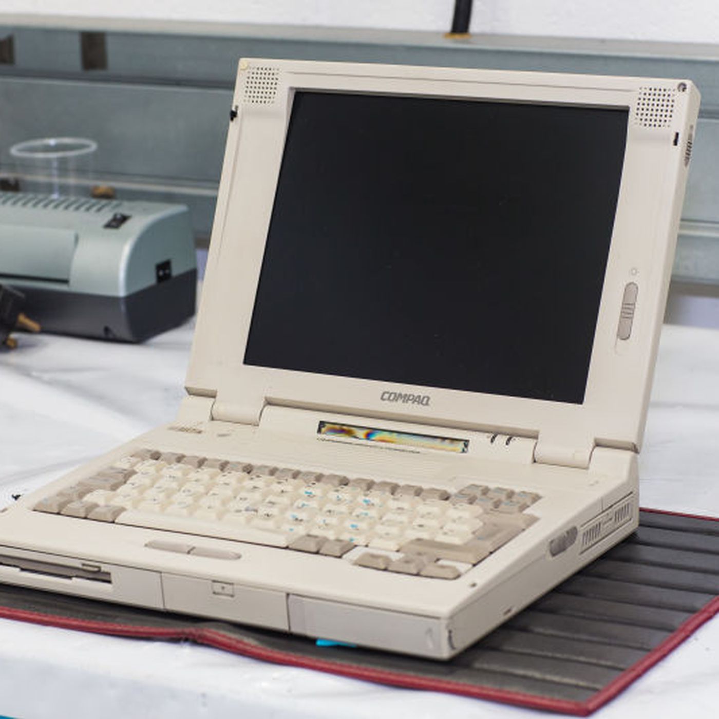 Which brand produced the first commercially successful laptop?